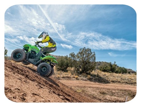 young rider on a kawasaki kids atv