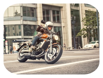 rider on a kawasaki vulcan s cruiser motorcycle