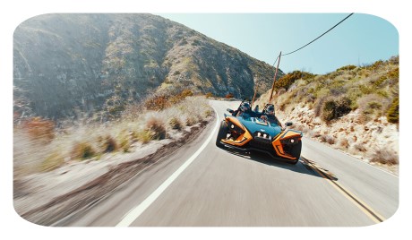 riders on a slingshot slr model motorcycle